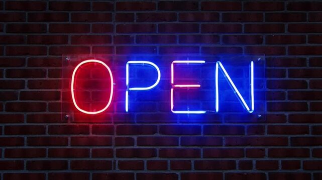 Neon open sign glowing on a brick wall at night