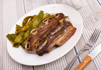 Churrasco de ternera, delicious grilled veal ribs with a side of beans