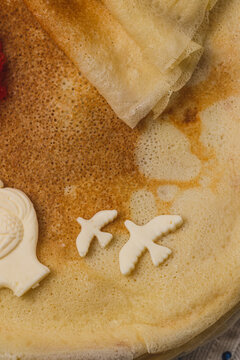 Pancakes on the table next to the samovar and caviar