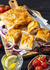 Greek savory sliced meat bougatsa pie with olives