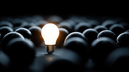 Obraz premium A Bright Light Bulb Surrounded by Dark Balls Representing Ideas, Creativity, and Innovation in a Unique Conceptual Composition