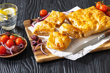 Greek savory sliced meat bougatsa pie with olives