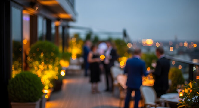 People mingling at a rooftop party with city lights in the background
