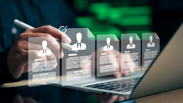Business person reviewing digital resume profiles on laptop. Concept of recruitment, human resources, hiring, and online candidate selection.