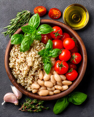 Gourmet Mediterranean Quinoa and Bean Salad with Fresh Herbs and Cherry Tomatoes in Rustic Wooden Bowl