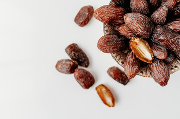 Minimalistic close up on a bowl of dates