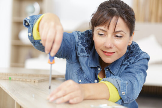 close-up the woman holding a screw-driver