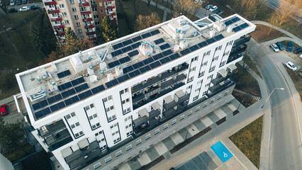 Modern city building rooftop solar energy system © AlexGo
