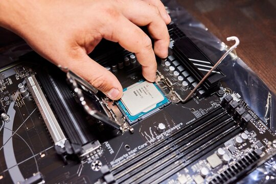Krasnodar, Russia: August 17, 2025: Gigabyte motherboard. Installing an Intel Core i5 processor. Assembling a desktop PC