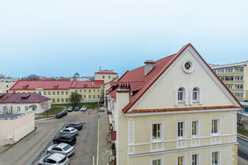 Obraz premium European City Courtyard with Historical Architecture and Red Roofs