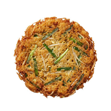Crispy vegetable pancake with green onions top view isolated. Traditional korean buchimgae side dish.