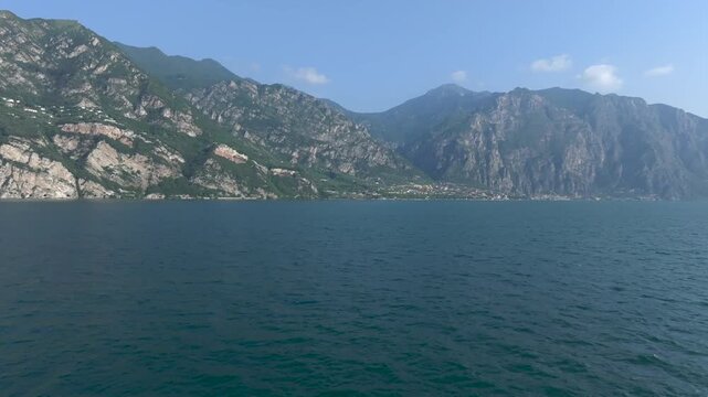 Europe Italy Lake Garda Drone flight above Water 4K 60 fps cinematic Travel destination Summer time