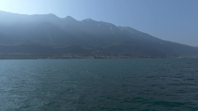 Italy Lake Garda flying over Water Aerial View Drone 4K Cinematic 60fps Summer time Travel Destination