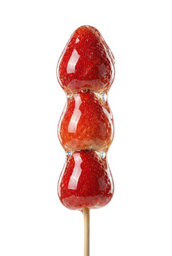 Candied strawberry skewer with hard sugar coating isolated. Popular tanghulu sweet fruit snack.