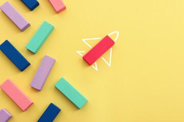 Concept image of a forming an airplane metaphor. Idea of leadership and education