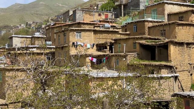 stepped terraced village in Kurdistan zagros mountain indigenous Kurdish mud brick adobe architecture traditional rural settlement with sustainable clay Turkey countryside authentic cultural landscape