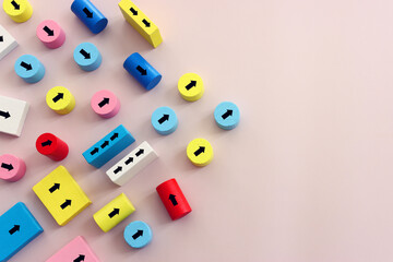 Arrows on wooden blocks, idea of thinking differently, setting goals and thinking about solution