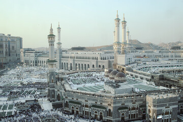 Majestic mosque complex with minarets and domes in bustling city © Queenmoonlite Studio