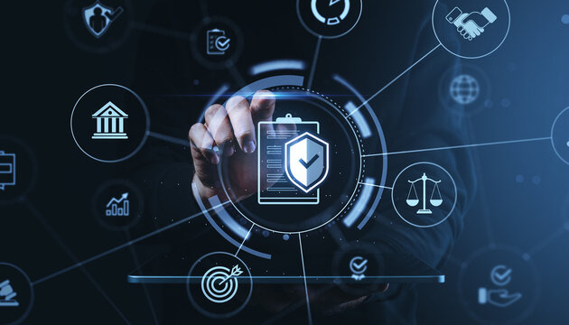 Businessman interacting with digital compliance and legal icons using futuristic interface on dark blue background, illustrating secure governance concept.