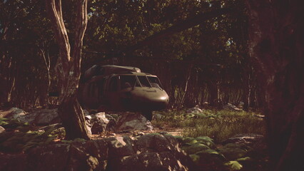A military helicopter is parked in a tranquil forest surrounded by tall trees and vibrant foliage. The sunlight peeks through the leaves, creating a peaceful atmosphere in nature.