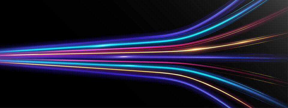 Abstract colorful neon light speed trails in motion on dark background.
