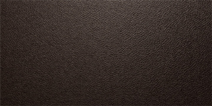 A dark black leather texture background featuring a natural macro pattern of rough animal hide material for a textured surface design