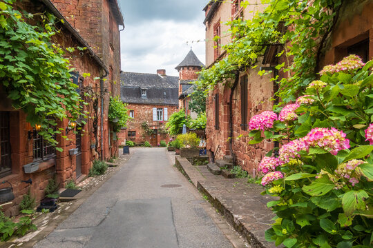 Red houses seen from the street in Collonges-la-Rouge - France