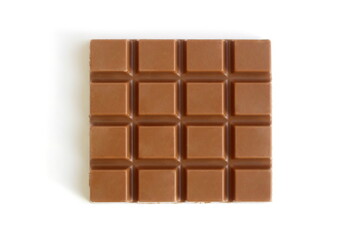 Fototapeta premium Chocolate with small pieces lies on a white background.
