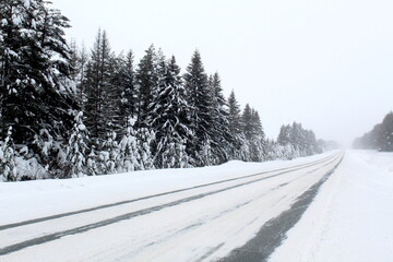 Obraz premium Winter track for cars covered with snow. 