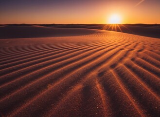 Golden Hour Desert Sunset Over Rippled Sand Dunes Creating Dramatic Shadows and Highlights Warm Light Rays Shining Through The Atmosphere