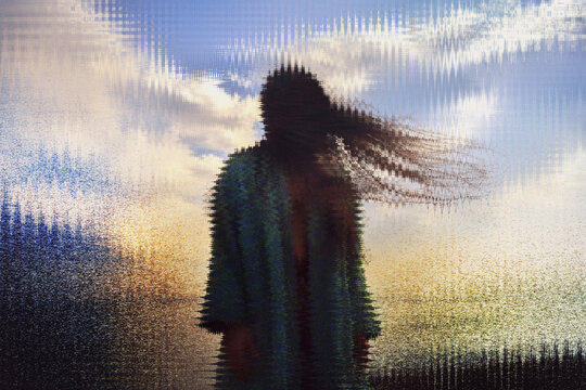 Silhouette in cyberspace with data noise and glitch effect outdoors