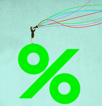 Businesswoman standing on percentage symbol communicating financial concepts