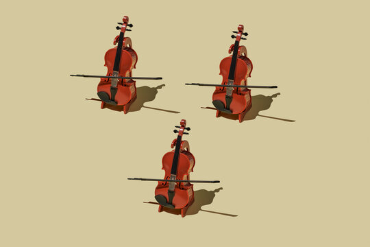 Three handcrafted cellos arranged in rhythmic minimalist pattern with shadow