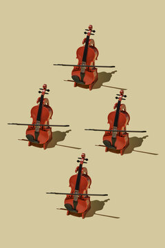 Four cellos arranged in playful geometric order on neutral background