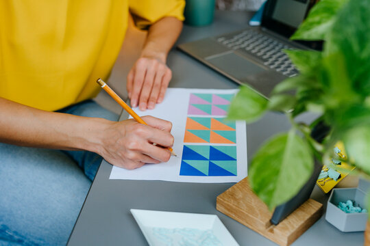 Designer working on graphic design at modern office desk