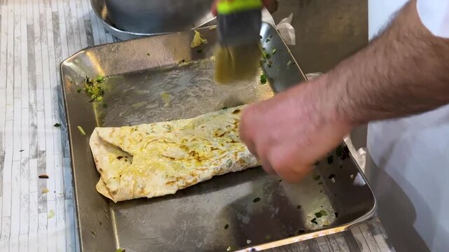crispy traditional bread baked local food herbs butter ghee Iran kalaneh Kurdistan crunchy crust bakery cooked flat delicious culinary culture baked thin saj metal griddle dough stuffed with scallion