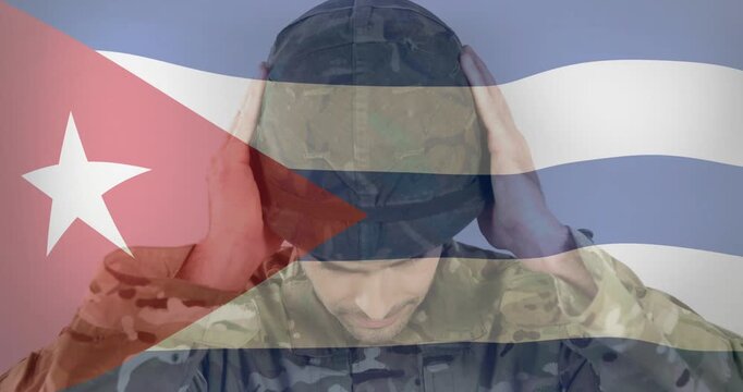 Male moving helmet to head, donning and securing fit for military use, Cuban flag overlay rippling