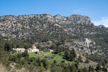 Obraz premium Panagia Apsidiotissa byzantine monastery church showcasing historic architecture and cultural heritage in rugged kyrenia mountains, cyprus