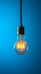 Glowing Hanging Light Bulb on Blue