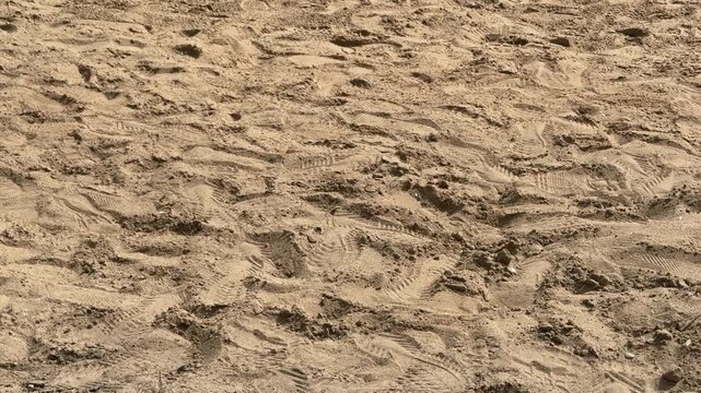 Sand texture background with footprints