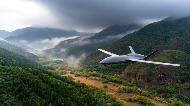 Unmanned aerial vehicle flying over a vast mountain valley, demonstrating autonomous surveillance capabilities and advanced technology for remote reconnaissance