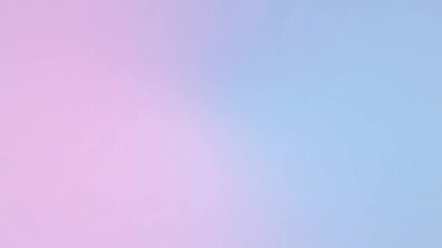 Soft, muted background featuring gentle gradients of pink and offwhite color scheme