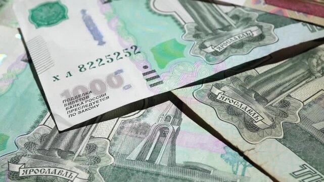 Paper banknotes of Russian rubles in a stack. Paper banknotes of Russian rubles of different denominations in a stack close-up