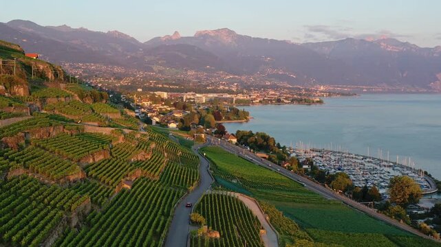 Montreux, Switzerland: Aerial footage following a car that drive the rural road in the stunning Lavaux vineyard near Vevey and Montreux by the Riveria of lake Geneva in Canton Vaud, Switzerland