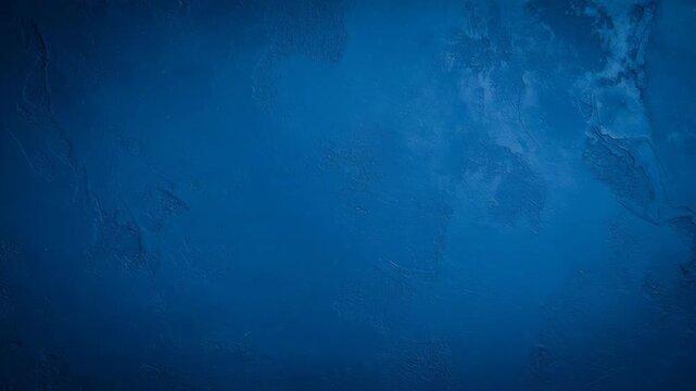 Abstract textured deep blue surface with radiating patterns and concentric circles