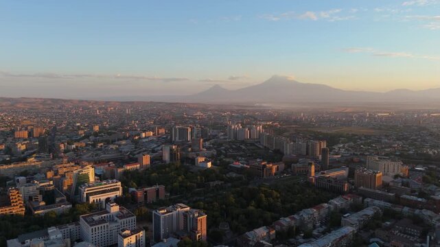 A view of Yerevan city with Ararat mountain in background. Downtown Yerevan Houses Backed by Mount Ararat, Armenia. mountain view from city. Sunrise and mountain Ararat from Yerevan City.