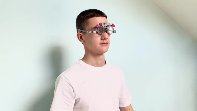 Young man trying on optometry trial frame for eye examination indoors