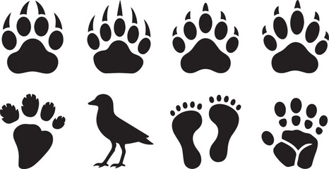 Collection of black animal paw prints and human footprints isolated on a white background for graphic design elements © md