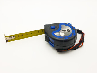 Retractable tape measure tool isolated on white