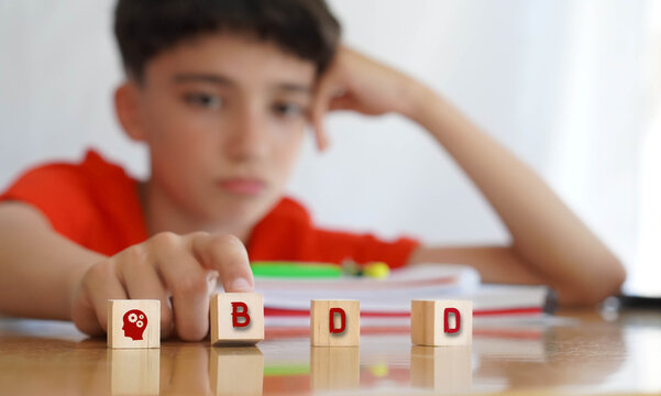 BDD. mental health concepts. preteen boy frustrated doing homework, importance of educational needs and special attention to this problem.